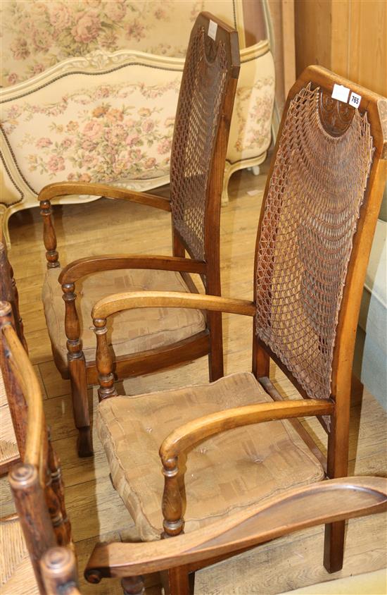A pair of Art Deco style caned back armchairs